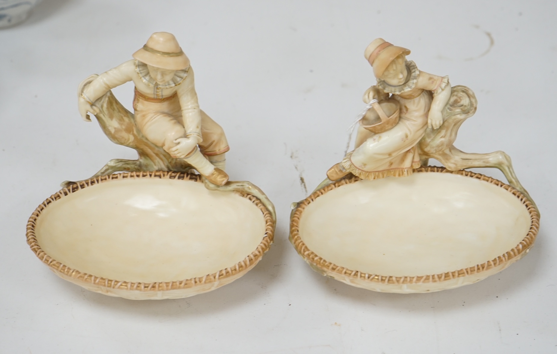 A pair of Royal Worcester sweetmeat dishes modelled by James Hadley, impressed numbers 775 and 776, 16cm. Condition - good